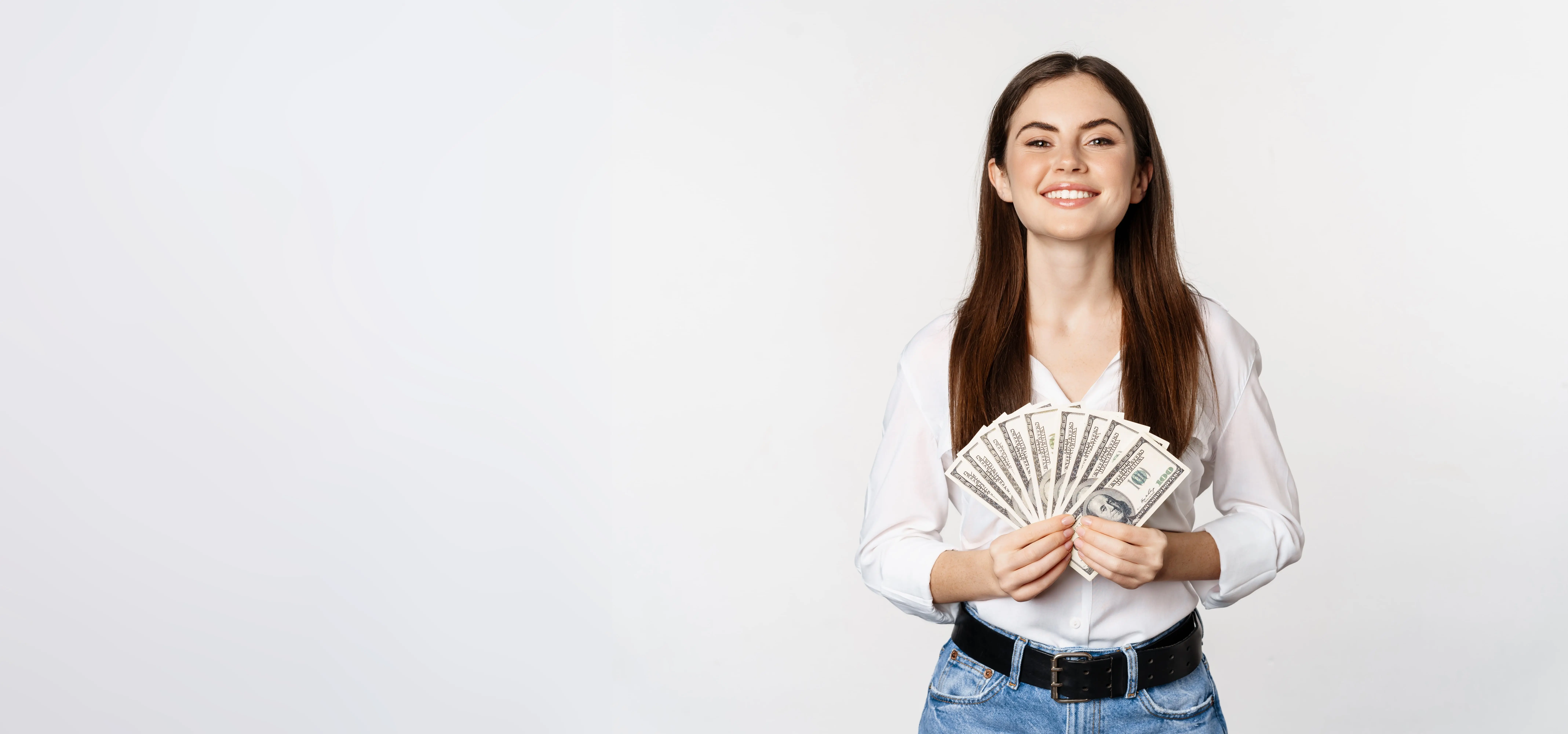 Smiling woman holding cash, highlighting SBA 7(a) loan with simple document requirements